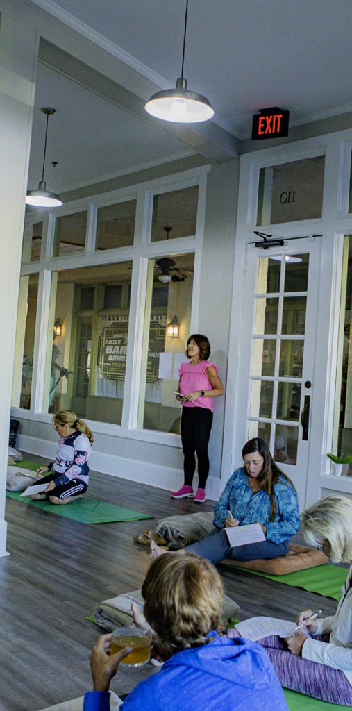 a group of women sitting on the floor