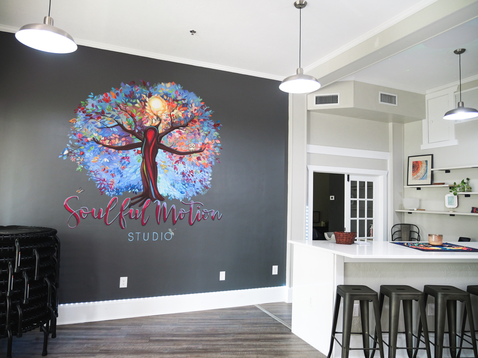 Colorful mural in a studio space.